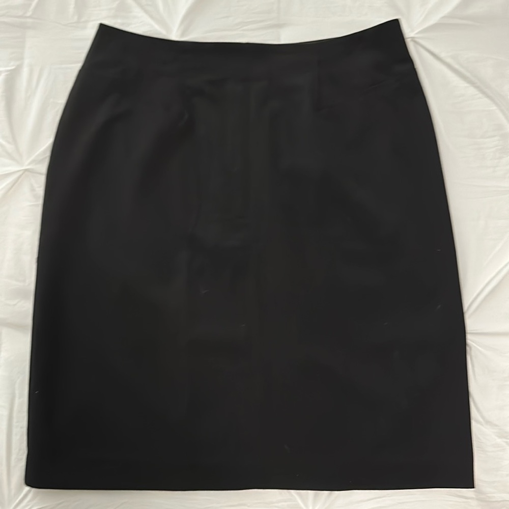 New, never worn, black, pencil, knee length skirt. Size 10.